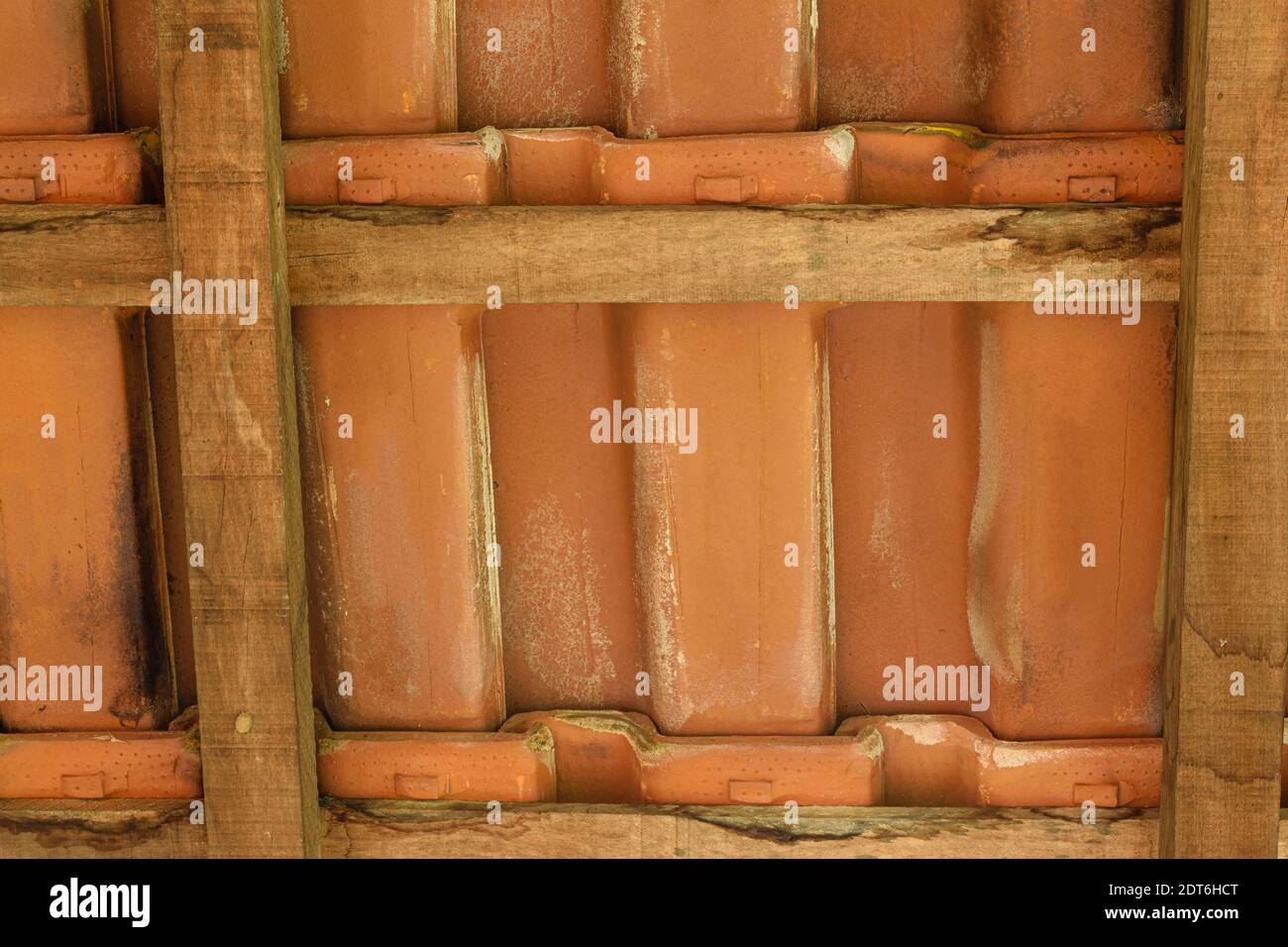 Shingles and wooden slats texture. View from under the roof. Stock Photo