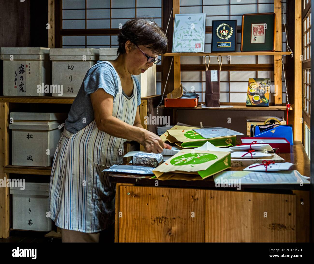Japanese are masters of packaging. Ms. Uchino wraps the tea, which can only be purchased locally in small quantities, in beautiful envelopes. Japanese Green Tea Farm of Shizuoka, Japan Stock Photo