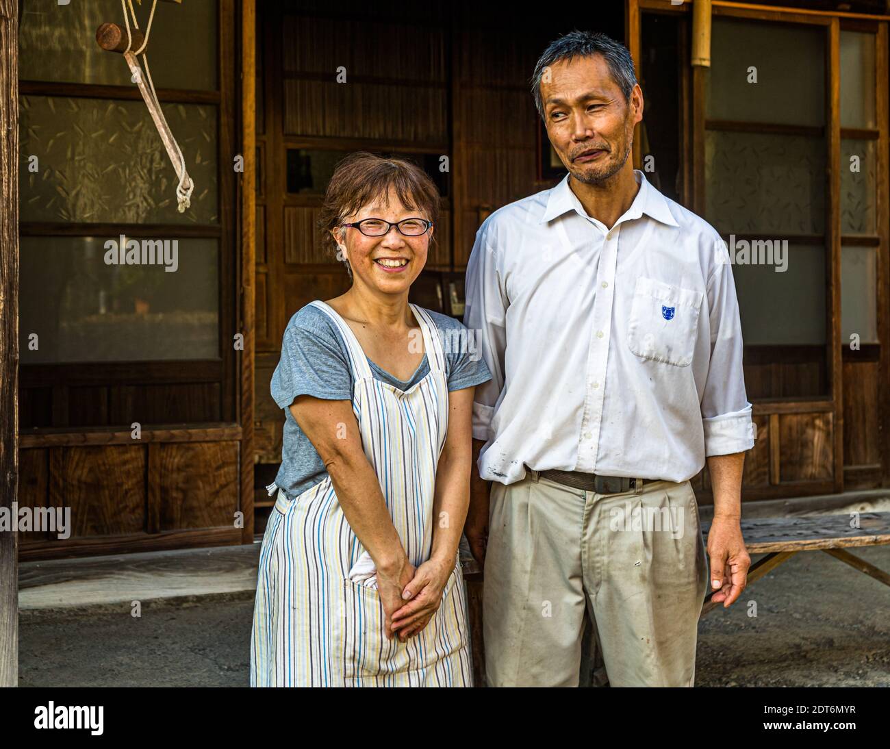 The Uchino couple in front of their farm. The tea farmers' son is 25 years old and is studying. The parents hope for the continuation of the family business. But the decision on this lies with the son. His grandparents still help with the tea processing. Japanese Green Tea Farm of Shizuoka, Japan Stock Photo
