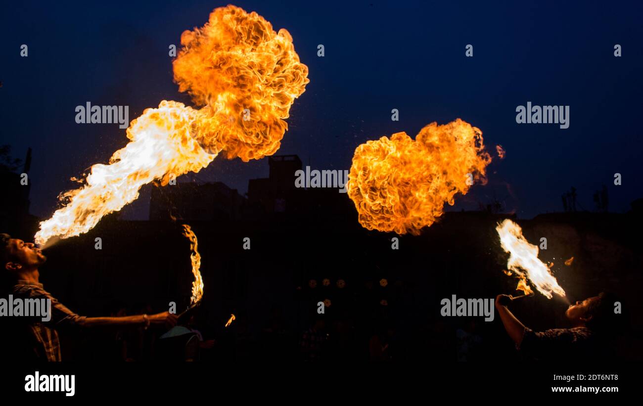 People Throwing Flame Outdoors Stock Photo Alamy