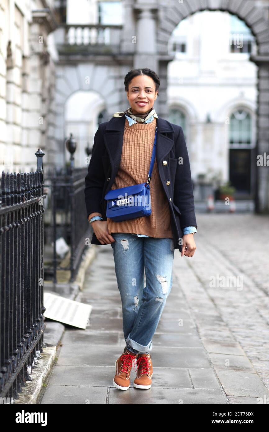 Michelle Bobb Parris, photographer and blogger (www.whoisbobbparris.com)  attending London fashion week Ready-to-Wear Autumn-Winter 2014-2015 held at  Somerset House, in London, UK on February 15th, 2014. She is wearing  Vintage coat, Asos jeans,