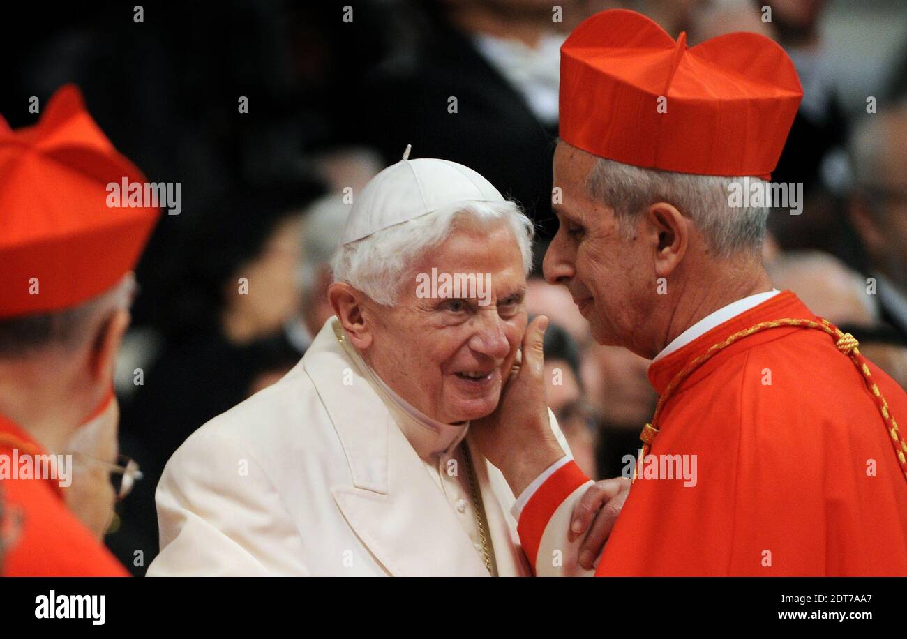 Former Pope Benedict XVI greats new cardinal Mario Aurelio Poli (Argentina)  as Pope Francis inducts 19 new cardinals during a consistory in Saint  Peter's Basilica at the Vatican on February 22, 2014.