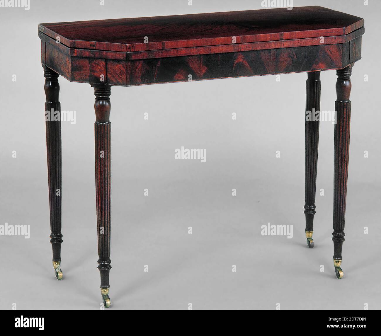 Maker, attributed to: Charles-Honore Lannuier, American, Card table, Mahogany, mahogany veneer; eastern white pine (front and side frame rails, glue blocks), black cherry (back frame rail, medial brace, stop pin), ash (pivot block), 30 1/8 × 35 1/2 × 17 13/16 in. (76.5 × 90.2 × 45.3 cm), Made in New York, New York, American, 19th century, Furniture Stock Photo