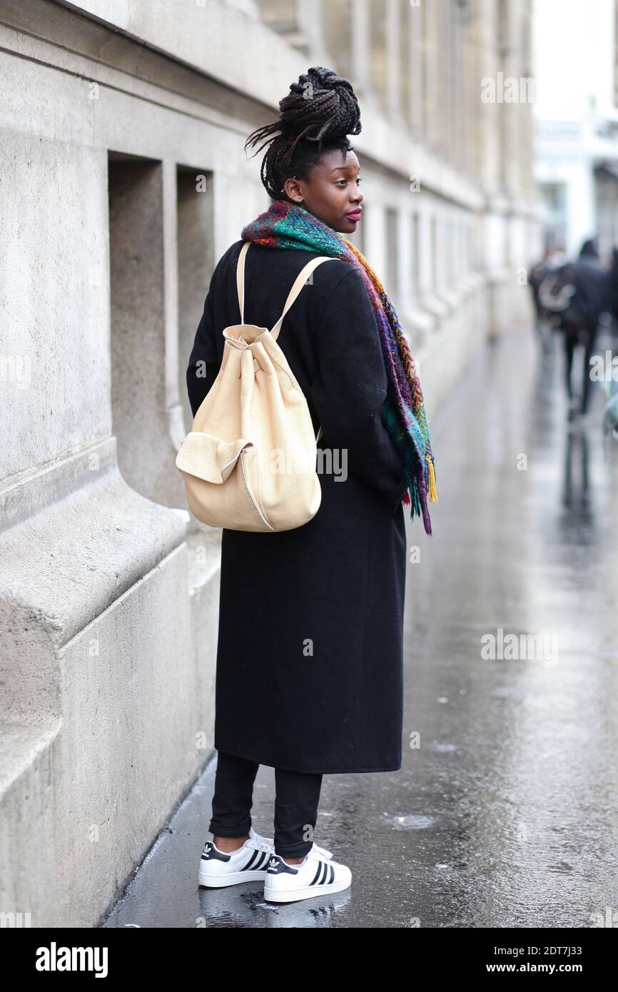 Aisha arriving for Ann Demeulemeester Autumn/Winter 2014-2015 Ready-to-Wear  show held at Couvent des Cordeliers, Paris, France on February 27th, 2014.  She is wearing C&A coat, vintage scarf, H&M pants, Adidas shoes, Trussardi