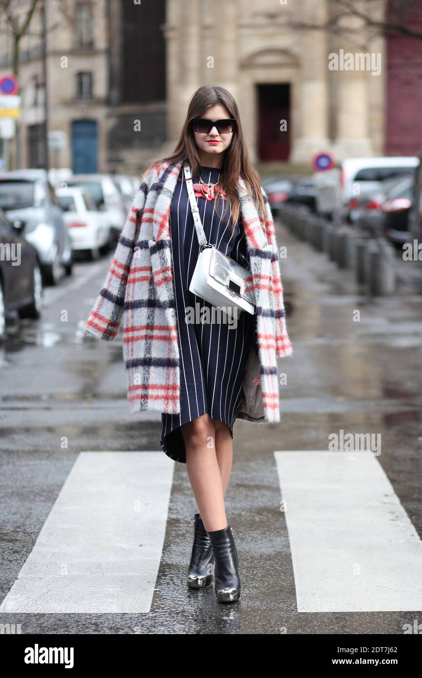 Elvira Abasova, fashion blogger (www.therussiancode.com) arriving for  Balmain Autumn/Winter 2014-2015 Ready-to-Wear show held at Hotel de Ville,  Paris, France on February 27th, 2014. She is wearing Ganni coat, Roger  Vivier bag, H&M