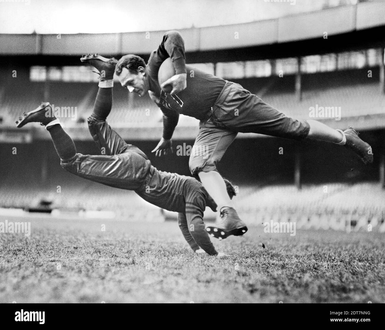 Chicago Bears Teammates Joe Zeller trying to tackle Red Grange during Practice, Alan Fisher, New York World-Telegram and the Sun Newspaper Photograph Collection, March 18, 1935 Stock Photo