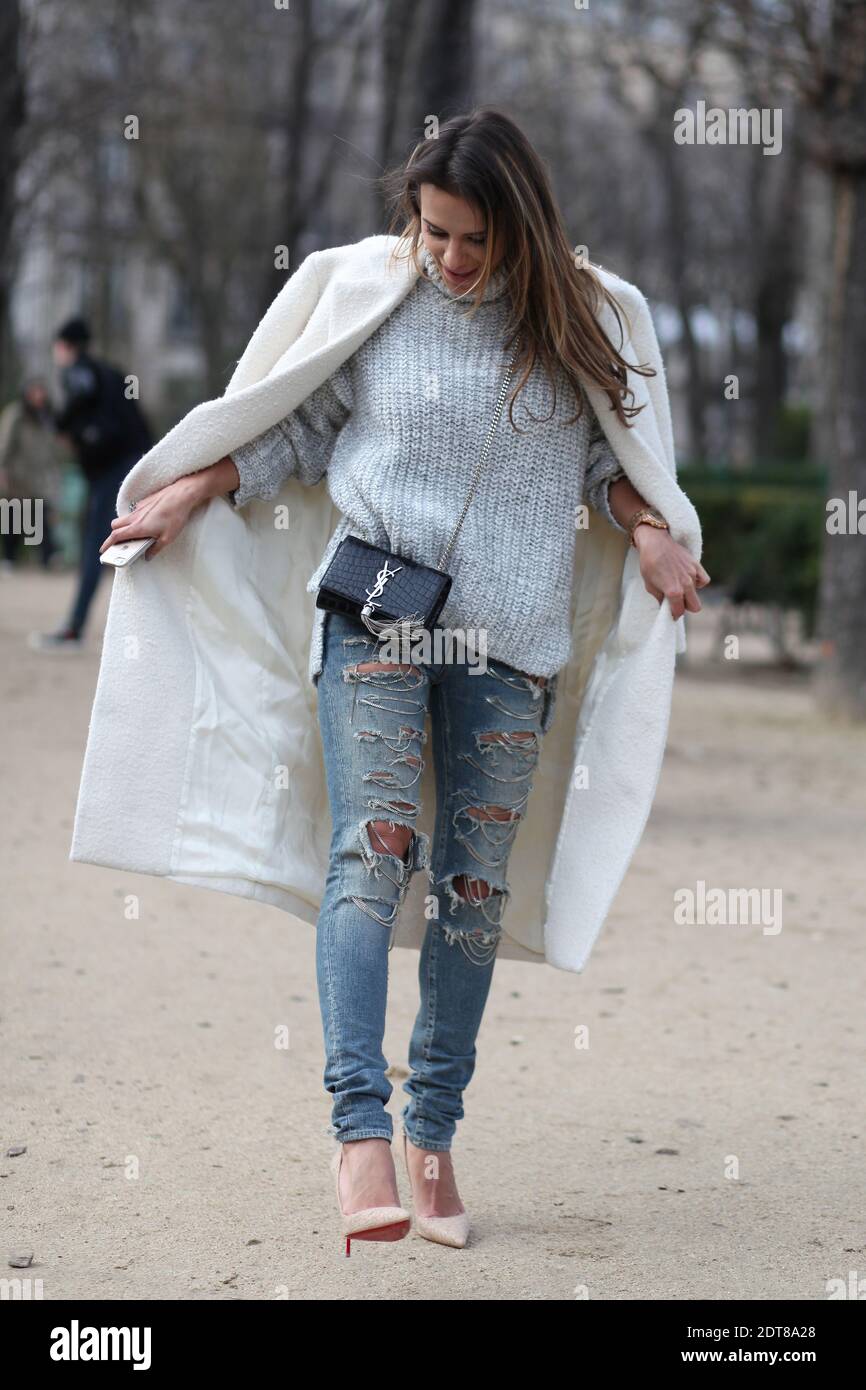 Sara Mannei, fashion blogger (www.sinbymannei.com) arriving for Chloe  Autumn/Winter 2014-2015 Ready-to-Wear show held at Grand Palais, Paris,  France on March 2nd, 2014. She is wearing Celine coat, Saint Laurent bag,  Zara jumper,