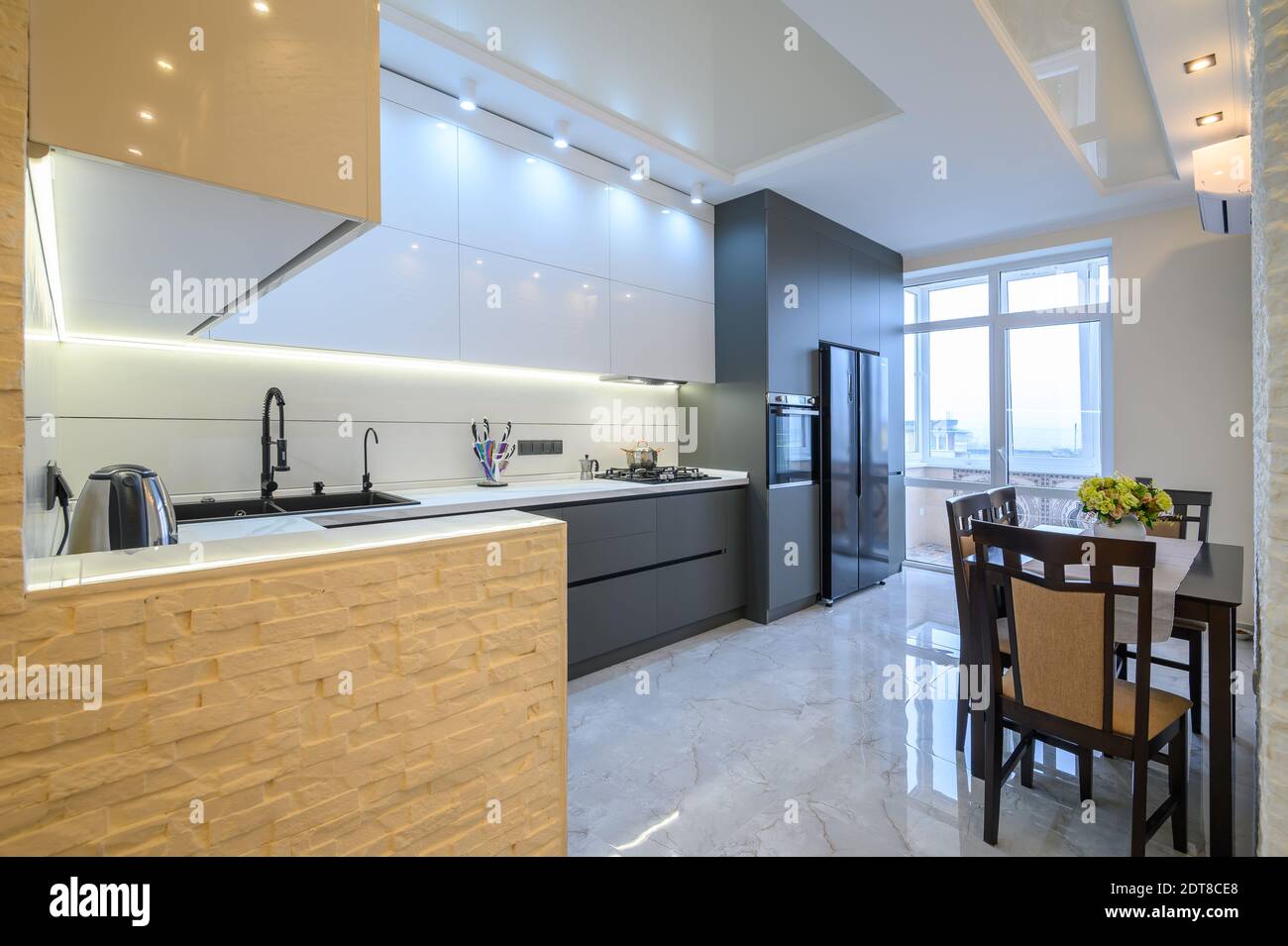 Luxury white and dark grey modern kitchen interior Stock Photo - Alamy