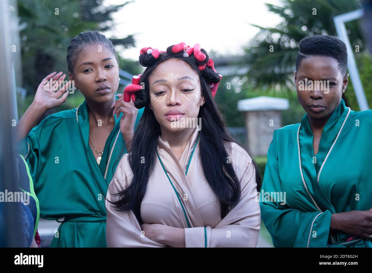 HOW TO RUIN CHRISTMAS: THE WEDDING, Thando Thabethe (center), Nambitha  Ben-Mazwi (right), (Season 1, aired Dec. 16, 2020). photo: ©Netflix /  Courtesy Everett Collection Stock Photo - Alamy