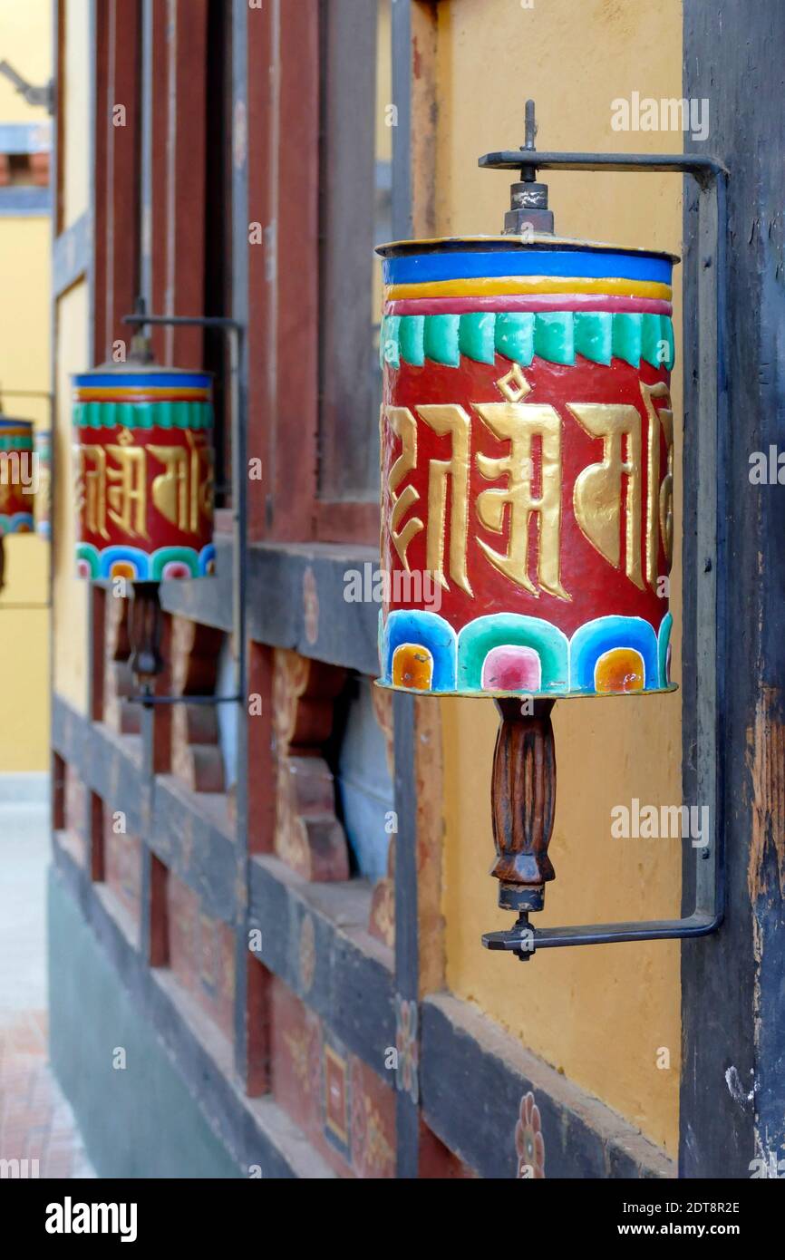 Prayer wheels repeating mantra "Om mani padme um" (Jewel in  the lotus)Zilukha Nunnery in Drubthob Goemb, Thimphu, Bhutan Stock Photo