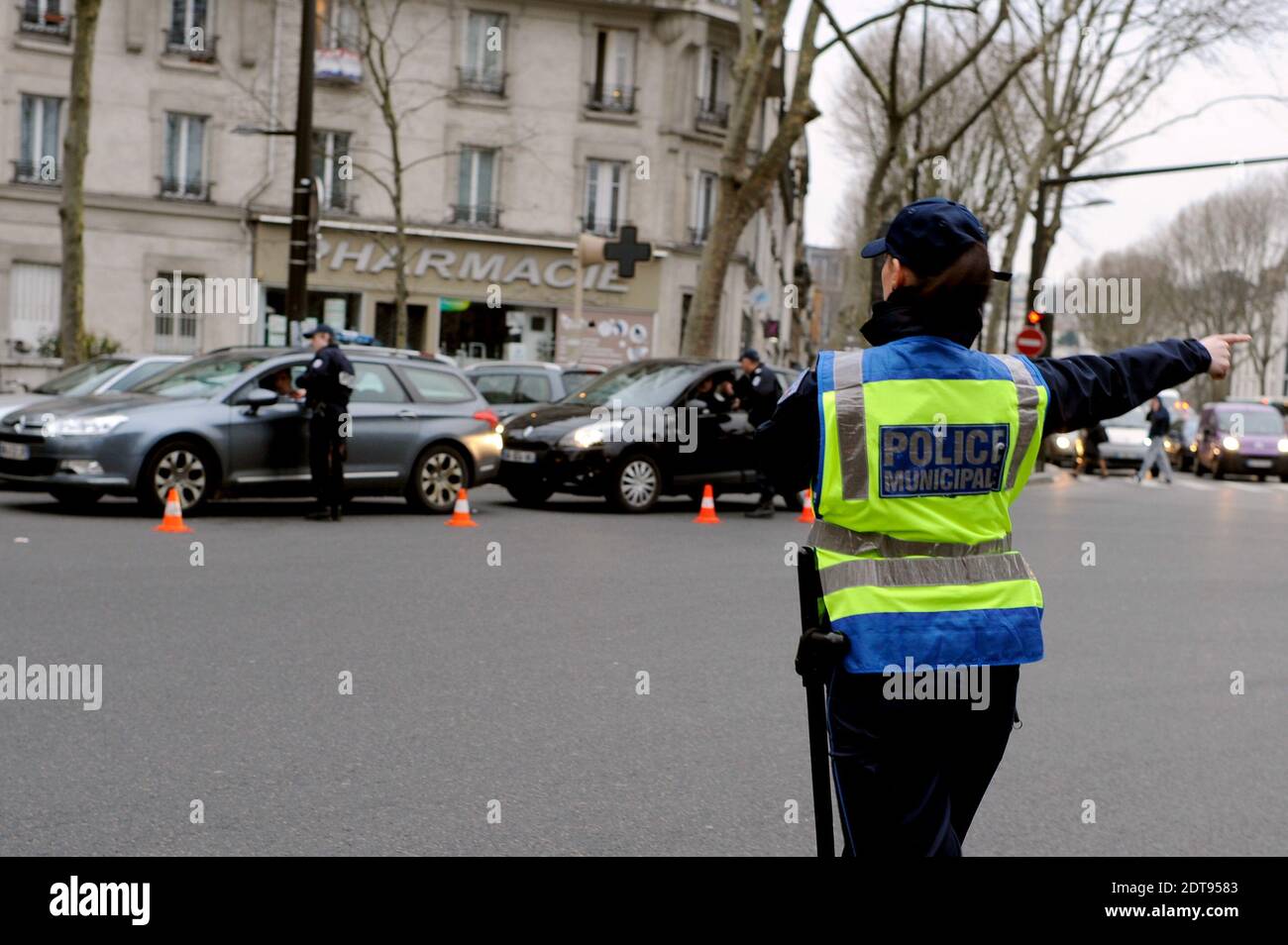 Police officers control cars with number plates ending in even numbers ...