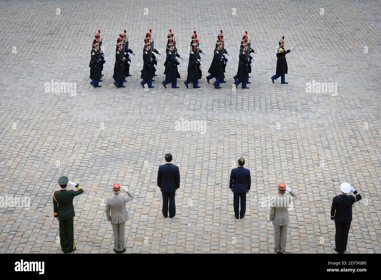 French President Francois Hollande and the President of the People's Republic of China Xi Jinping review the troops during a ceremony at the Hotel des Invalides in Paris, France on March 26, 2014. The Chinese President is on a three-day state visit to France. Photo by Nicolas Gouhier/ABACAPRESS.COM Stock Photo