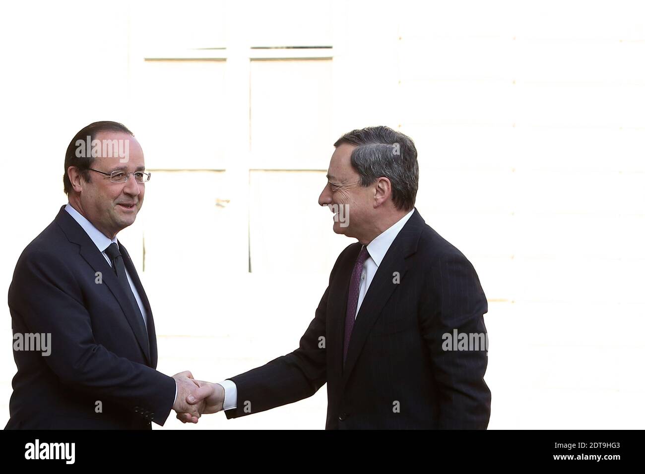 President Francois Hollande greets European central bank president Mario Draghi prior to a working breakfast at the Elysee palace, in Paris, France, on March 26, 2014. Photo by Stephane Lemouton/ABACAPRESS.COM Stock Photo
