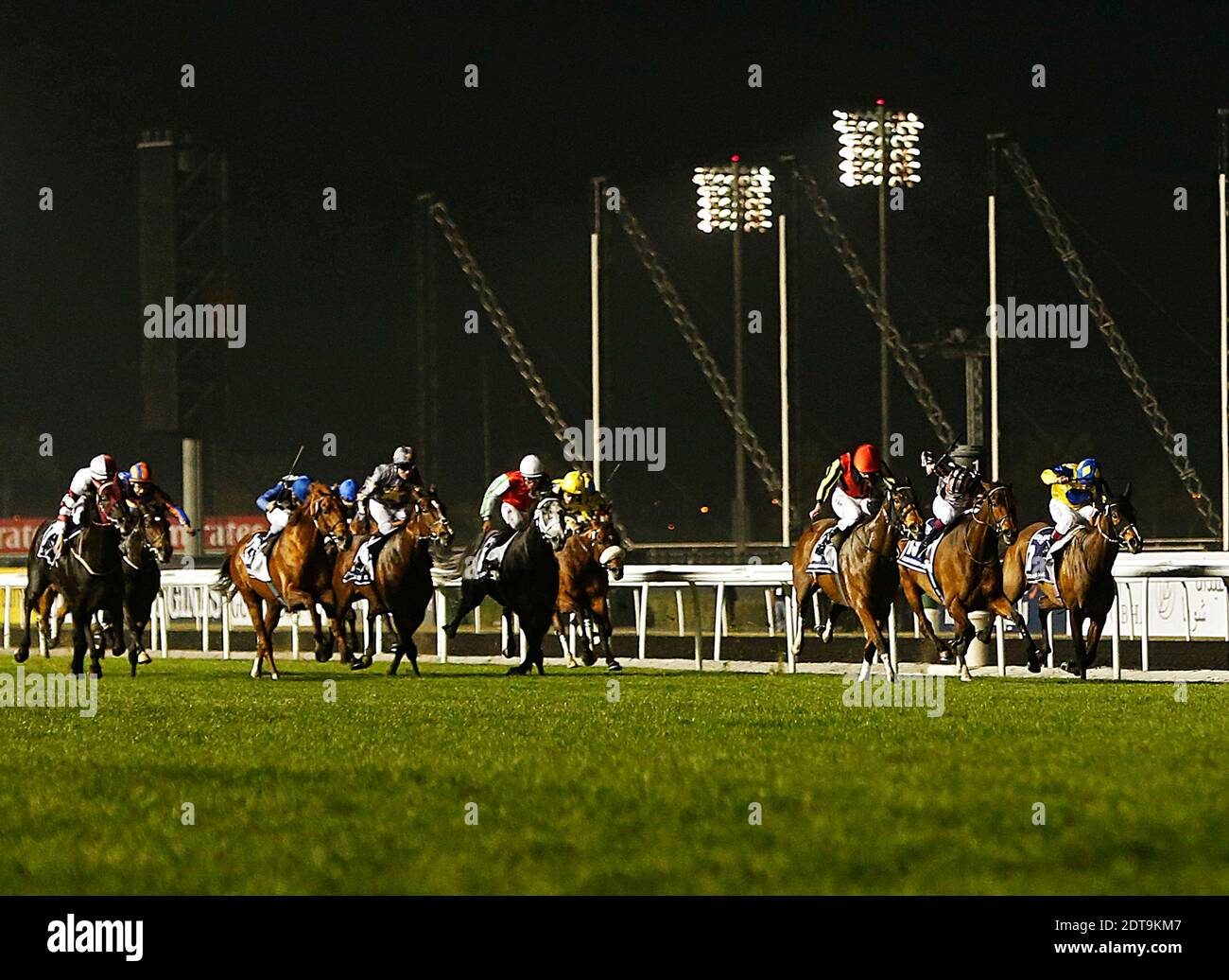 Jockeys compete in the Dubai Sheema Classic race held on Dubai World Cup day on March 29, 2013 at Meydan racecourse in Dubai, United Arab Emirates. A cosmopolitan gathering of horses from seven different countries contest the US$10 million Emirates Dubai World Cup at Meydan racecourse. Photo by Khaled Salem/ABACAPRESS.COM Stock Photo