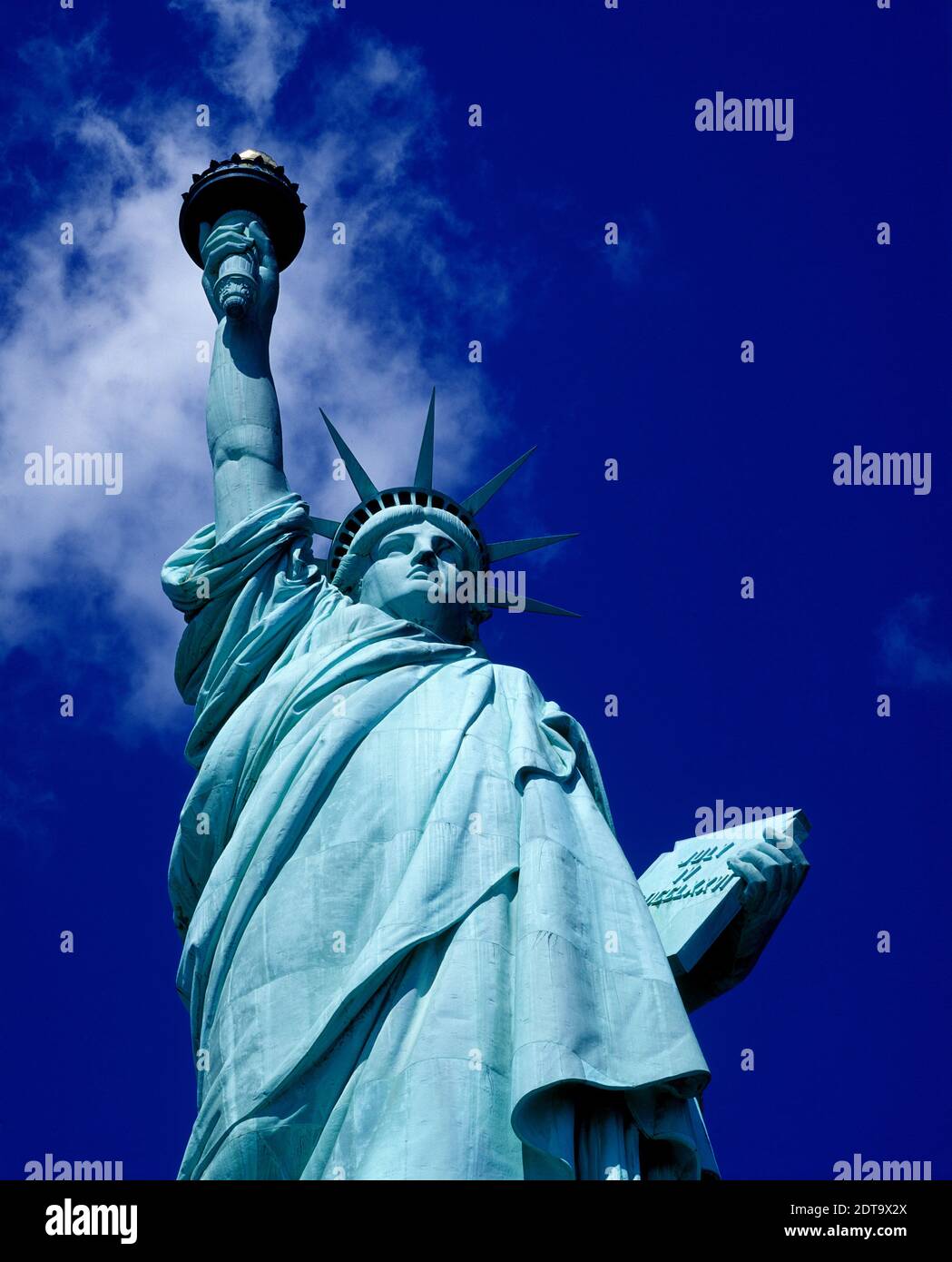 Tourist photographing the statue of liberty hires stock photography