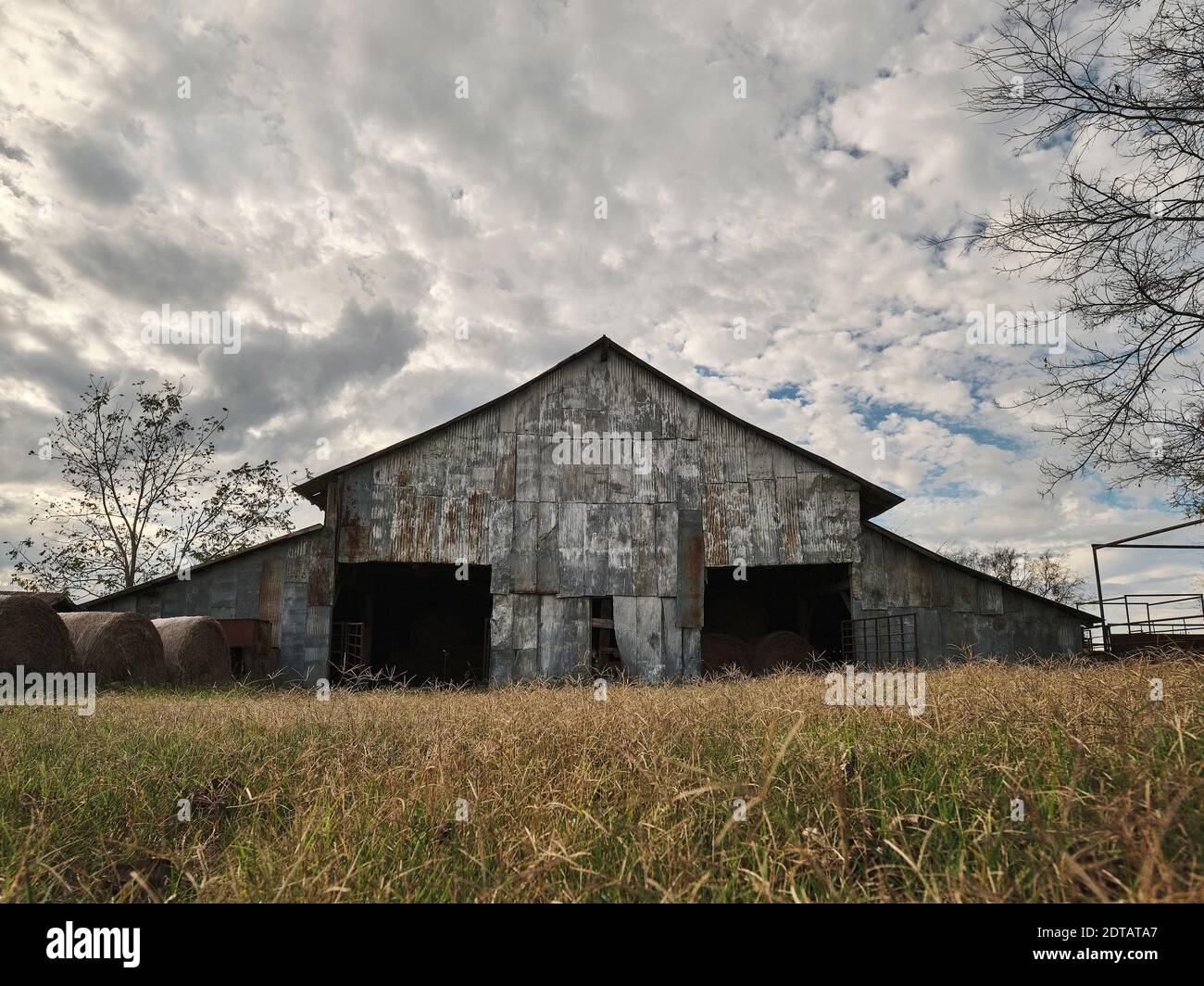 Old wooden hay barn exterior on a farm or ranch in Pike Road Alabama, USA. Stock Photo