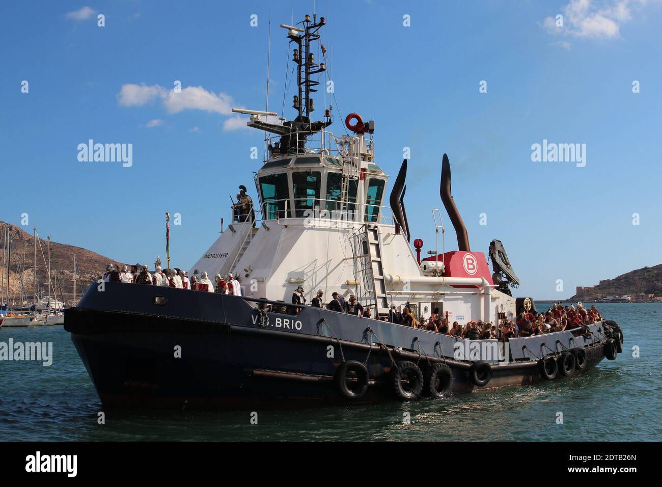 An annual event in Cartagena is the Cartaginians and Romans  festival. Some of the Romans invaded by sea. A modern work boat represents a Roman galley Stock Photo