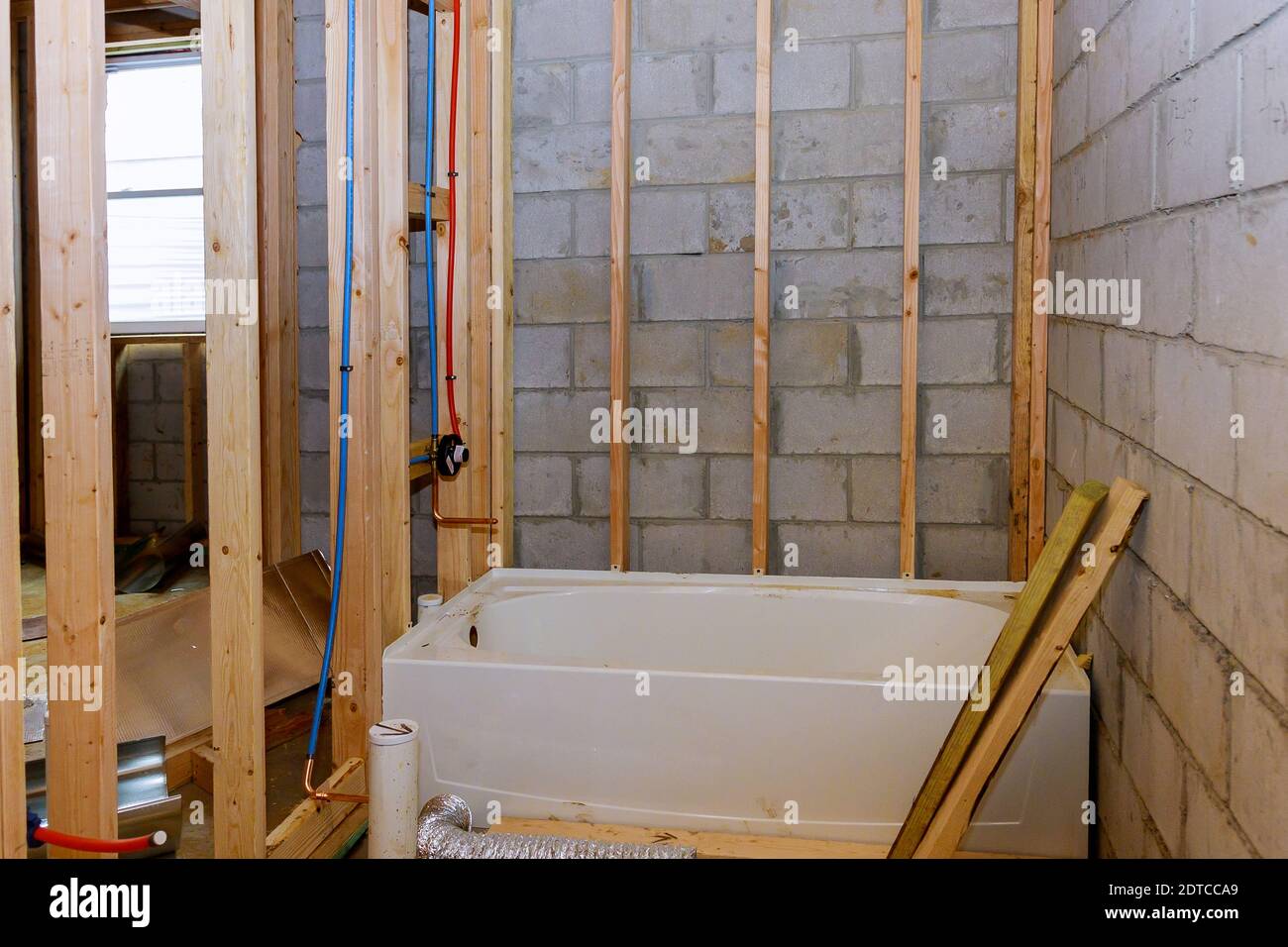 Bathroom showing plumbing work connecting installation of ...