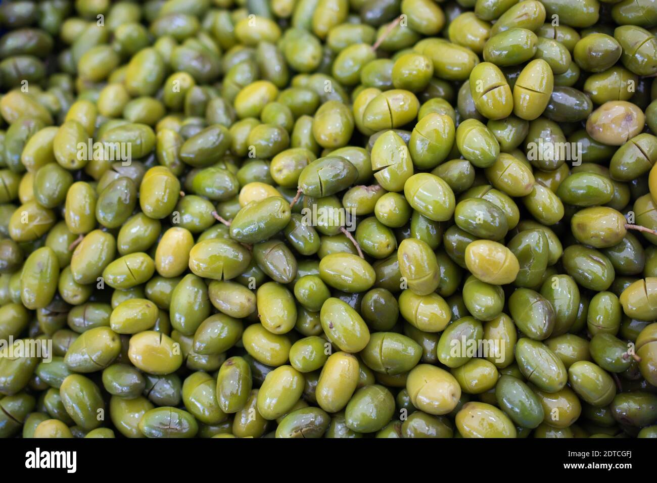 Green olives as health food preserved in olive oil Stock Photo Alamy