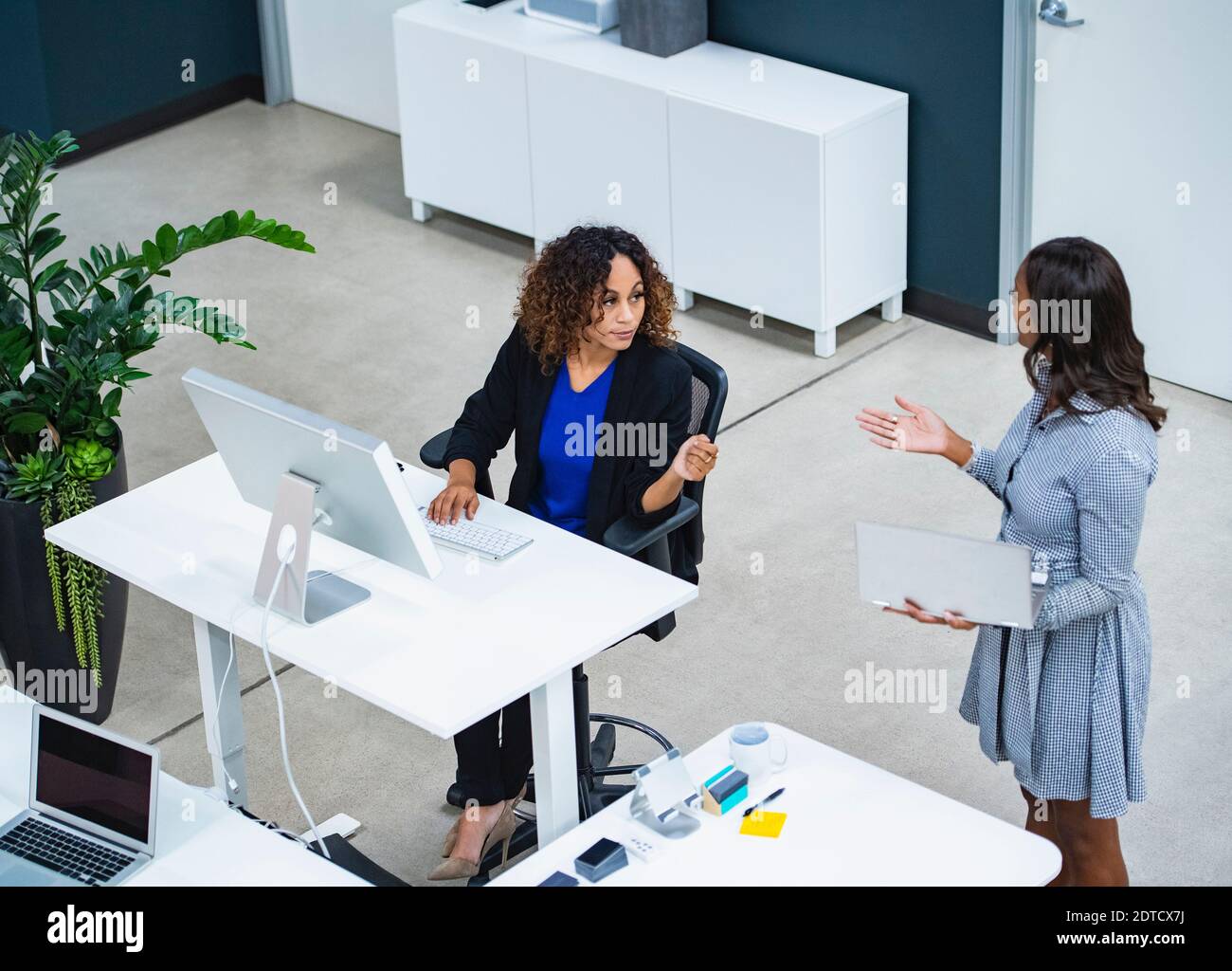 Two women working in office Stock Photo