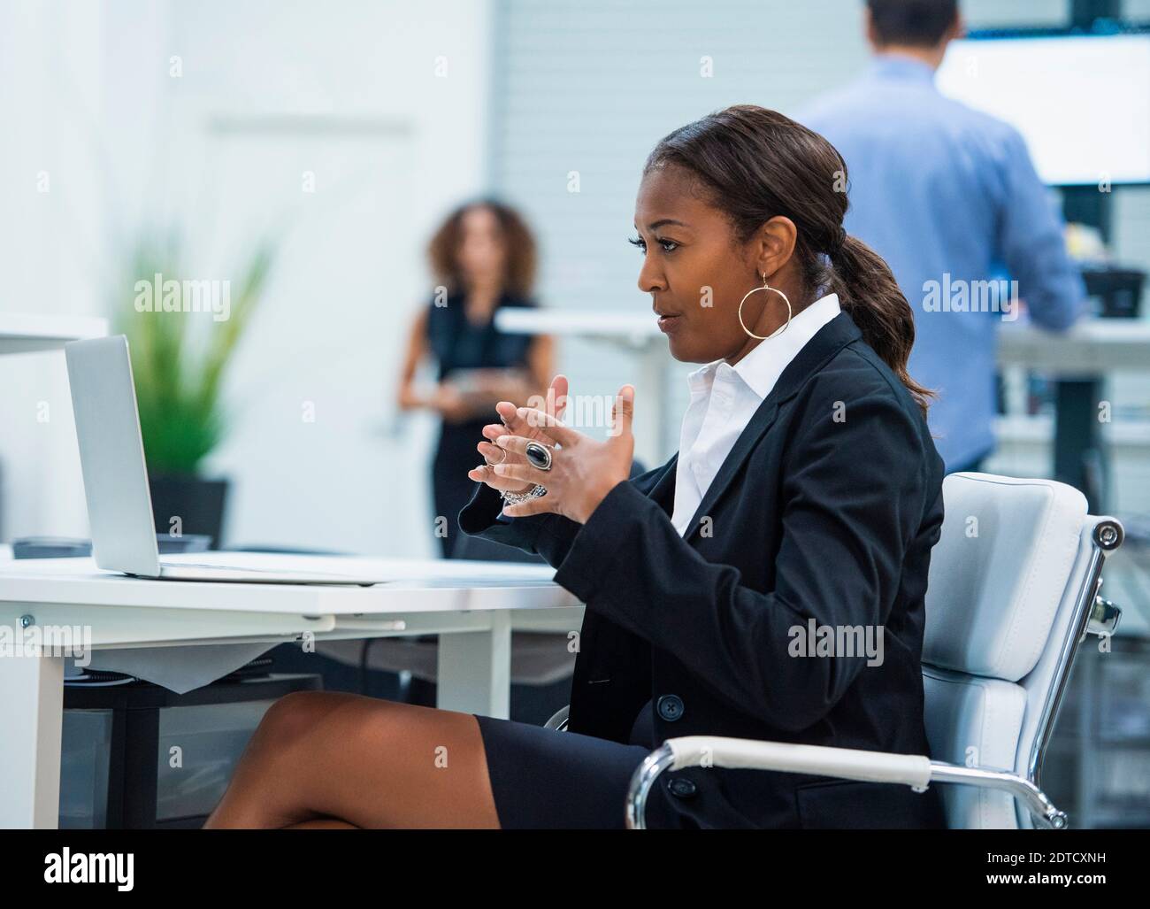Businesswoman having video call via laptop in office Stock Photo