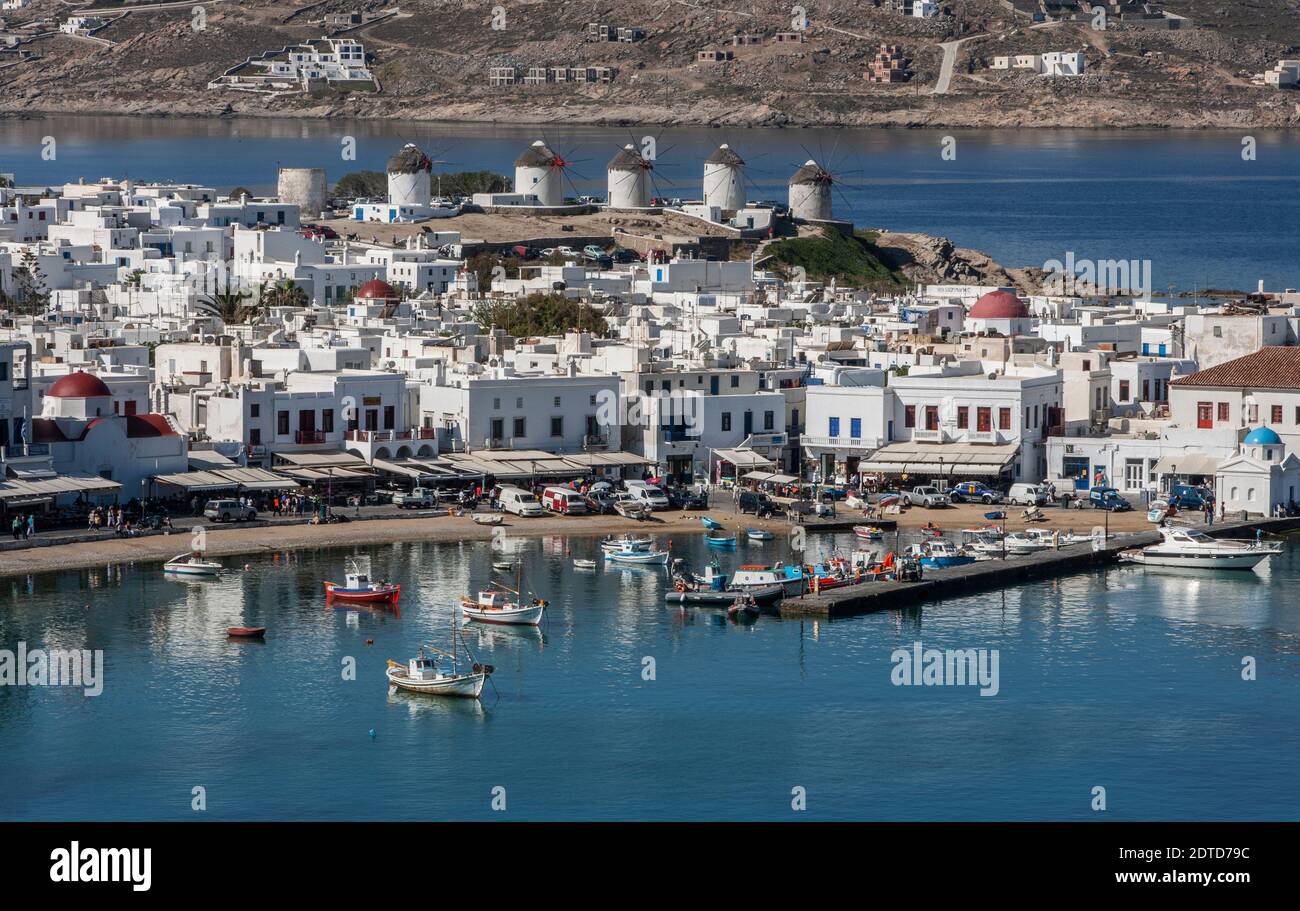 Greece, Cyclades Islands, Mykonos, Chora, Fishing boats in harbor and white houses Stock Photo