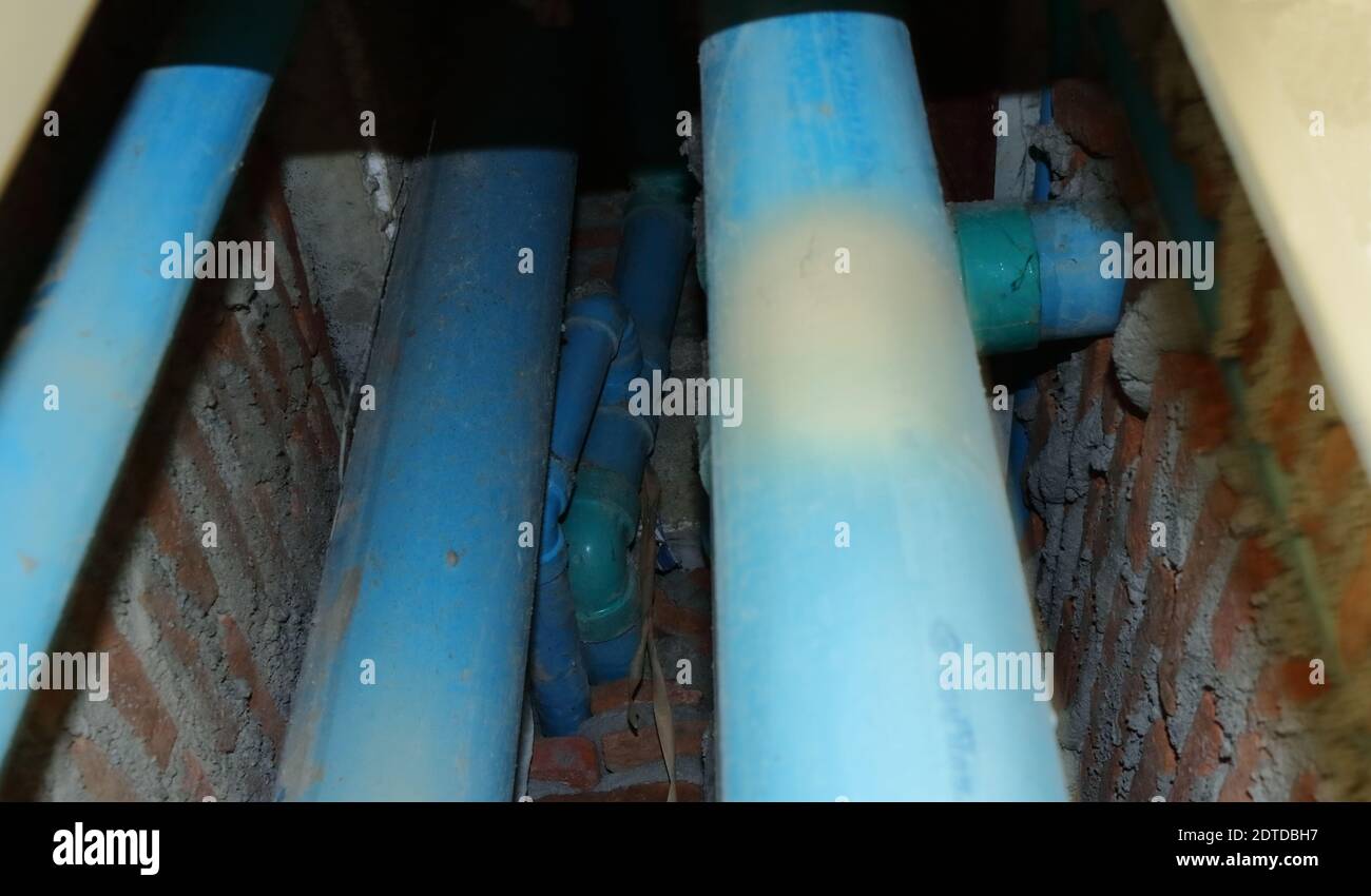 Selective focus on part of middle pipe among pipe system in the opening