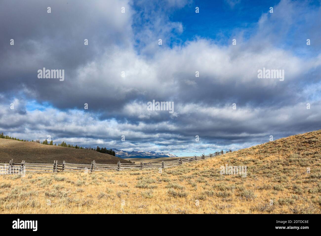 USA, Idaho, Stanley, Ranch landscape with clouds and mountains in distance Stock Photo