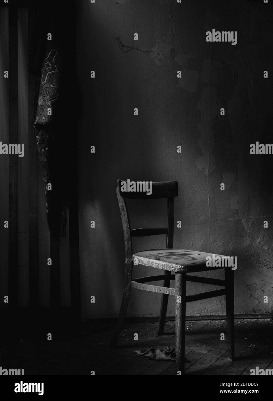 Empty Chair Against Wall In Abandoned Room Stock Photo Alamy