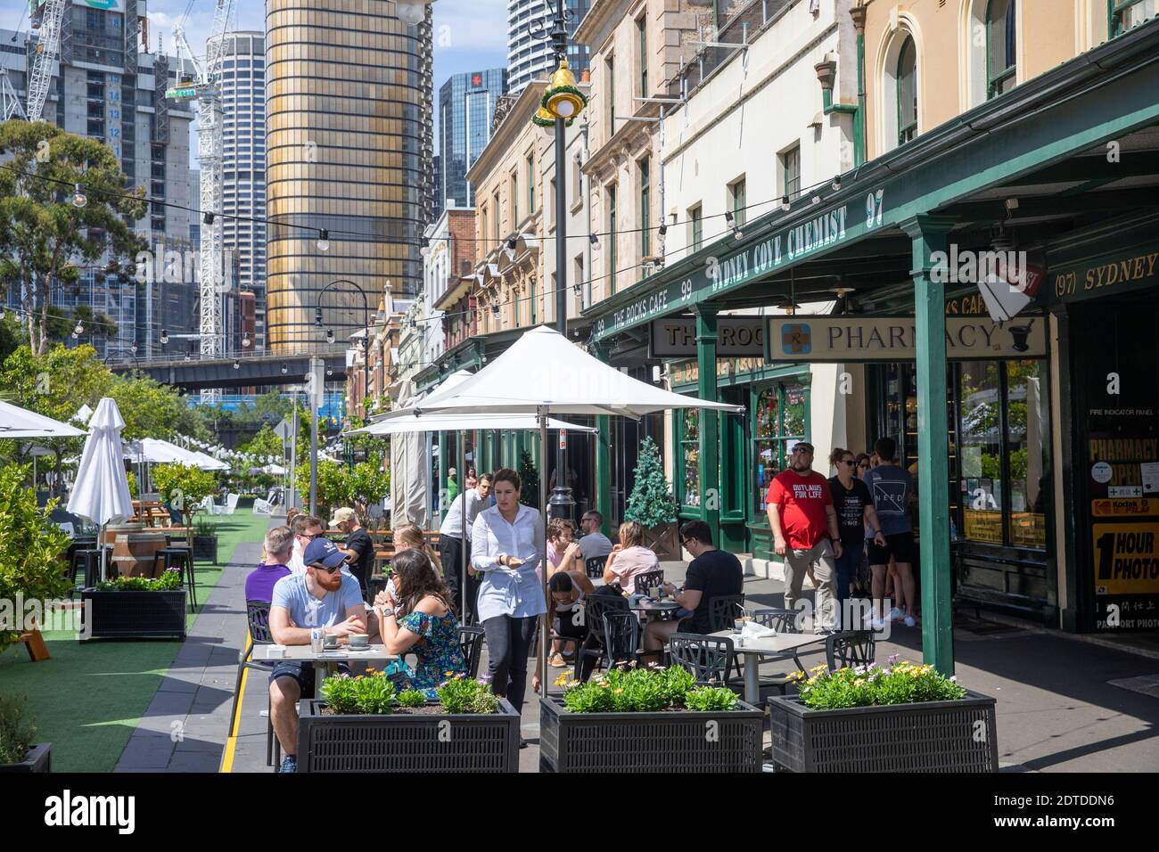The Rocks Sydney local cafe and view of the skyscrapers and office buildings in Sydney city centre,NSW,Australia Stock Photo