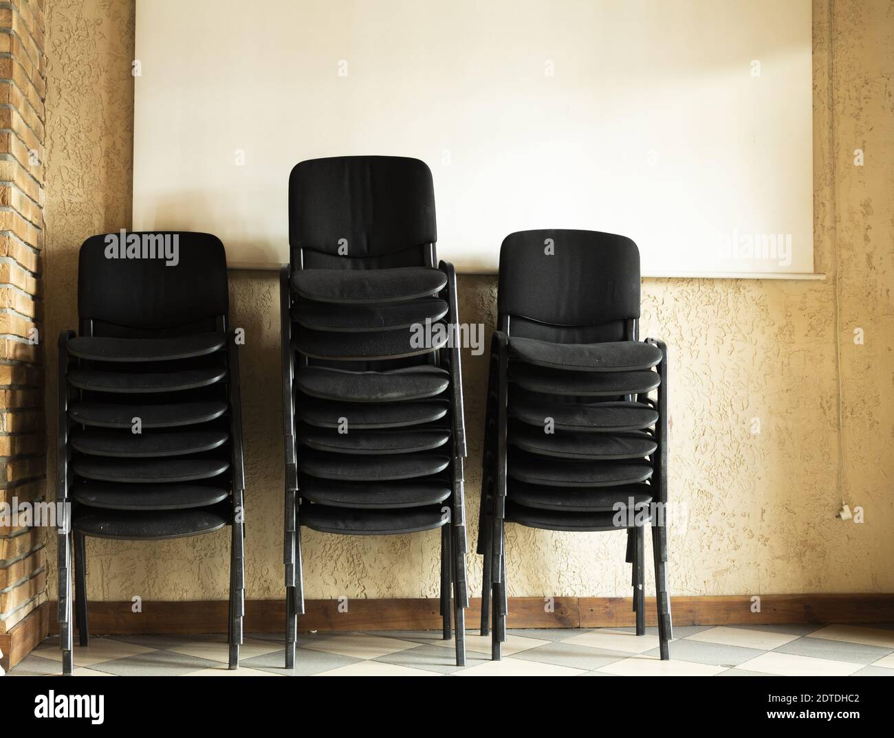 Stacked old and dirty office chairs Stock Photo Alamy