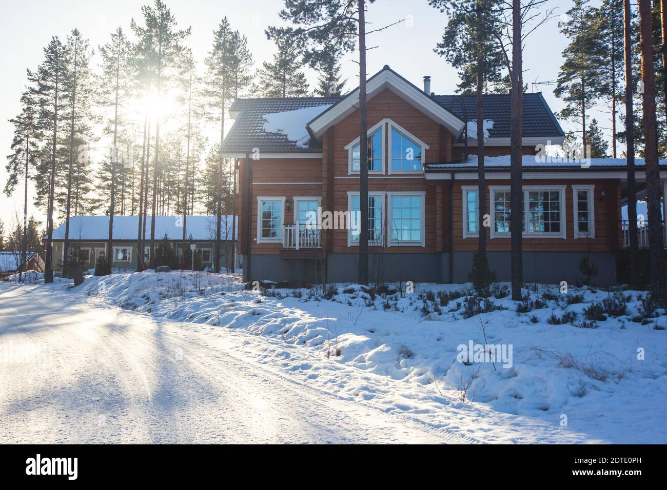 A view of cozy wooden scandinavian cabin cottage chalet house covered ...