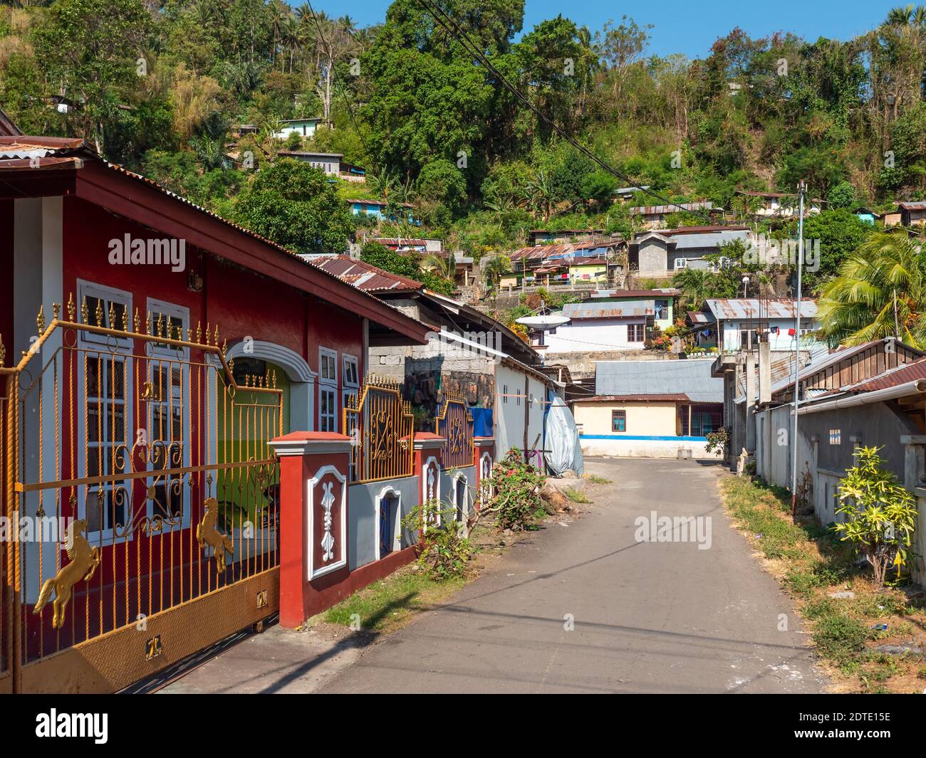 Village road in Tandurusa, a village in Bitung on Northern Sulawesi, Indonesia. Stock Photo