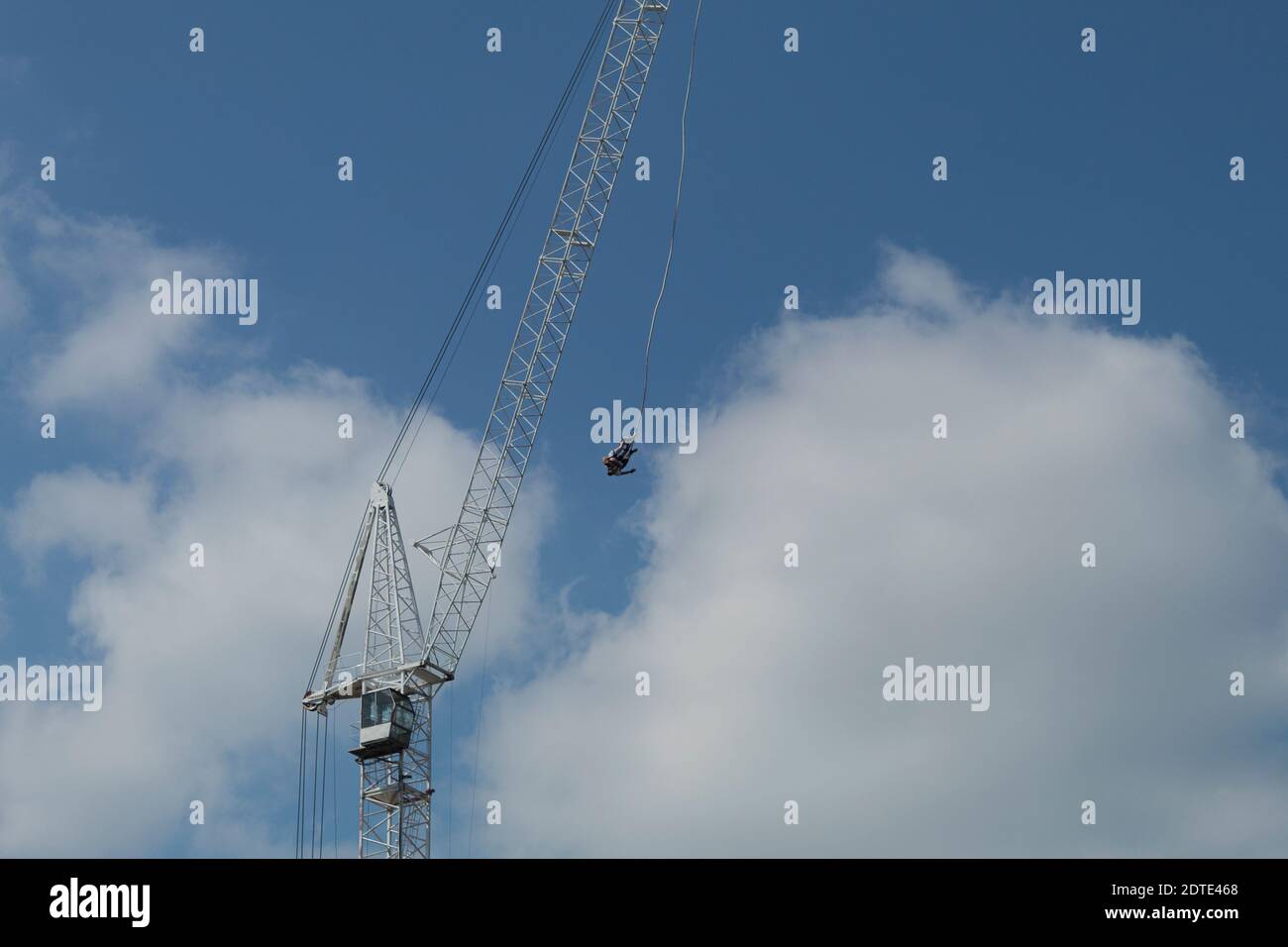 Jump from a height of a tower crane. Jumping from a tower crane