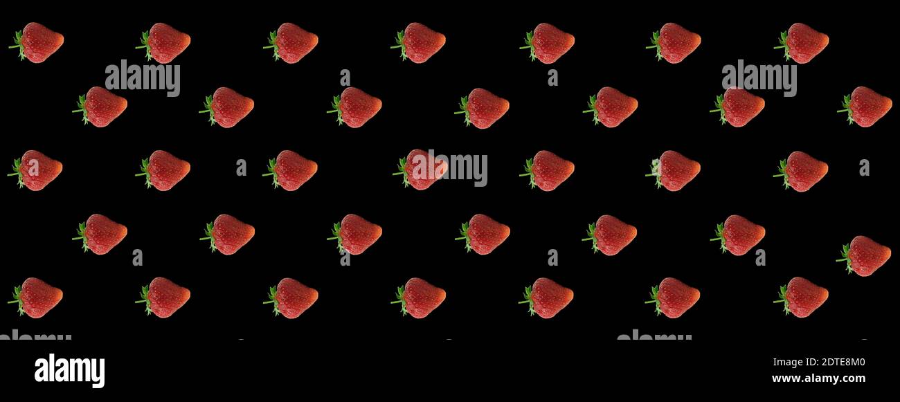 Strawberry pattern background on black. Blank for design. Wallpaper on a strawberry background Stock Photo