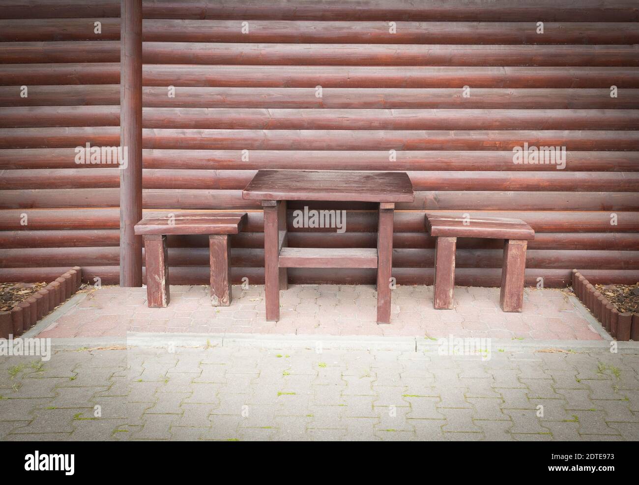 Table and two wooden stools Stock Photo