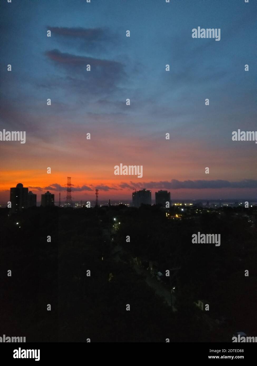 Silhouette Buildings Against Sky During Sunset Stock Photo