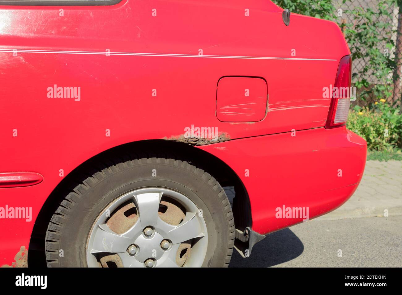 Rust on the rear fender of the car. Corrosion marks on the rear fender