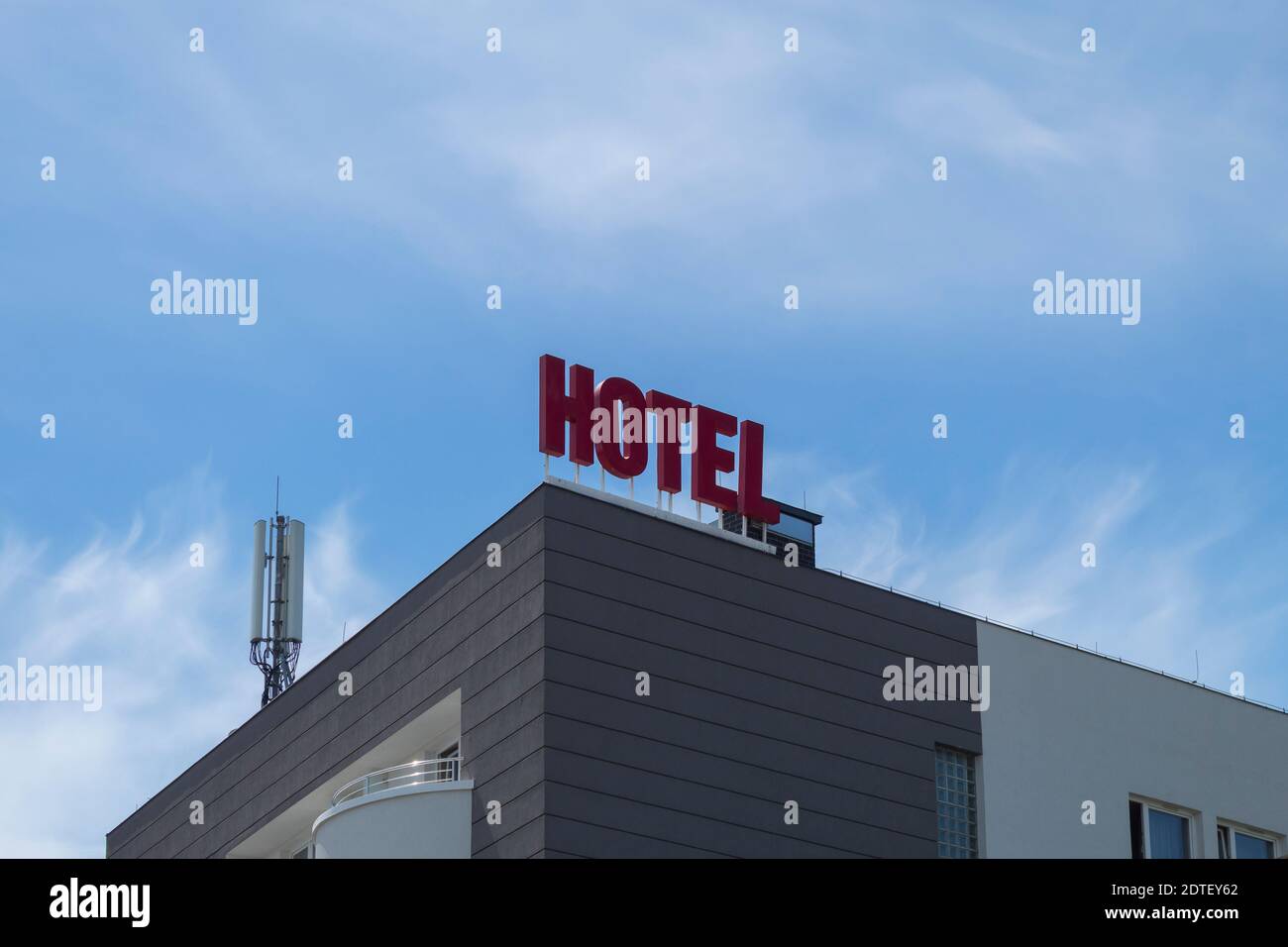 Hotel signboard on the building. Big red letters on the building with ...