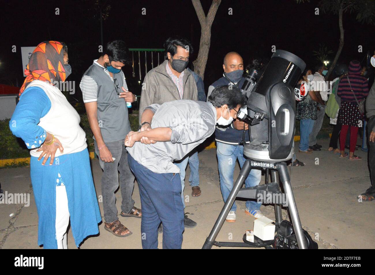 Bangalore, India. 21st Dec, 2020. A visitor observes the celestial