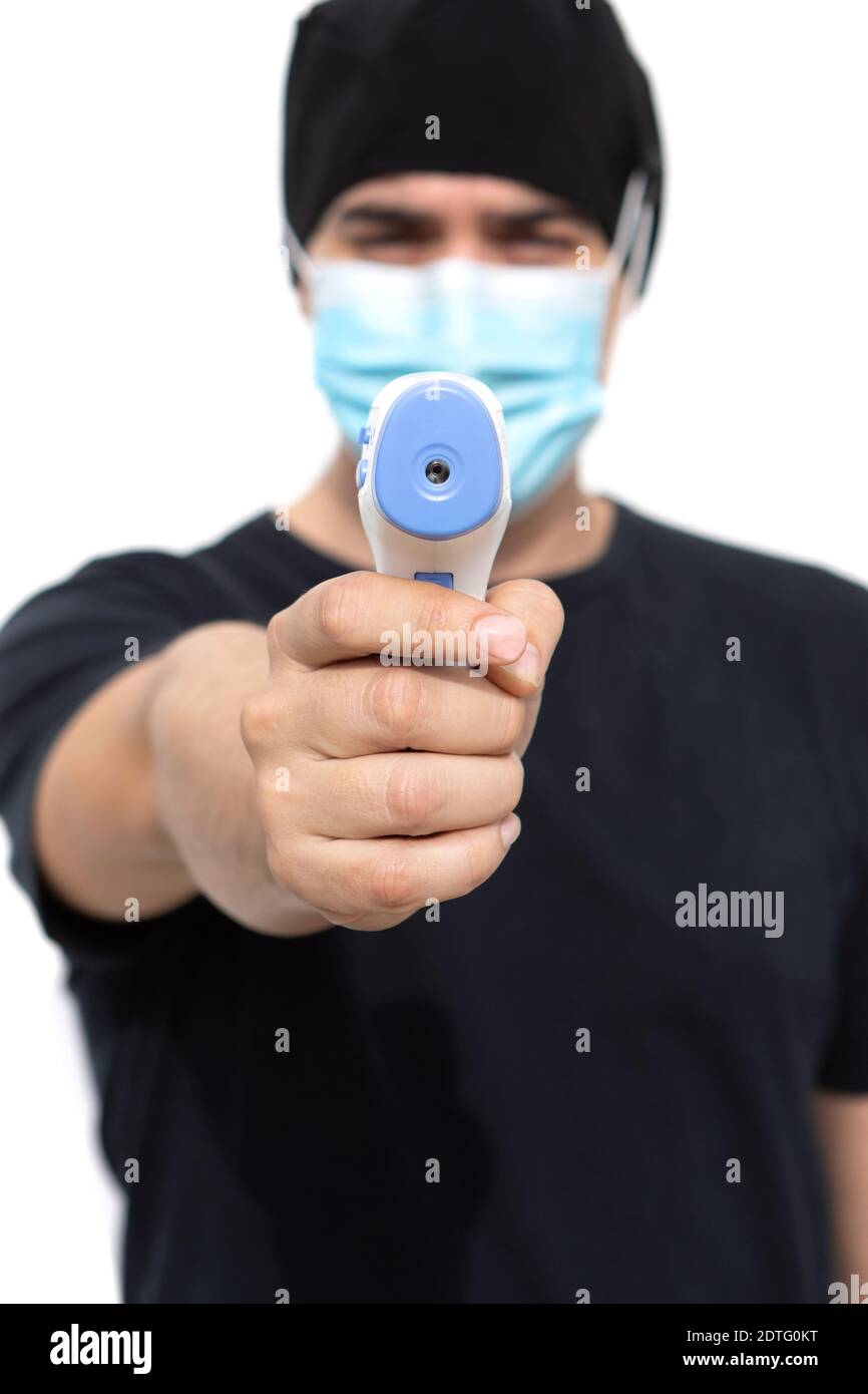 Doctor taking temperature with infrared thermometer Stock Photo Alamy