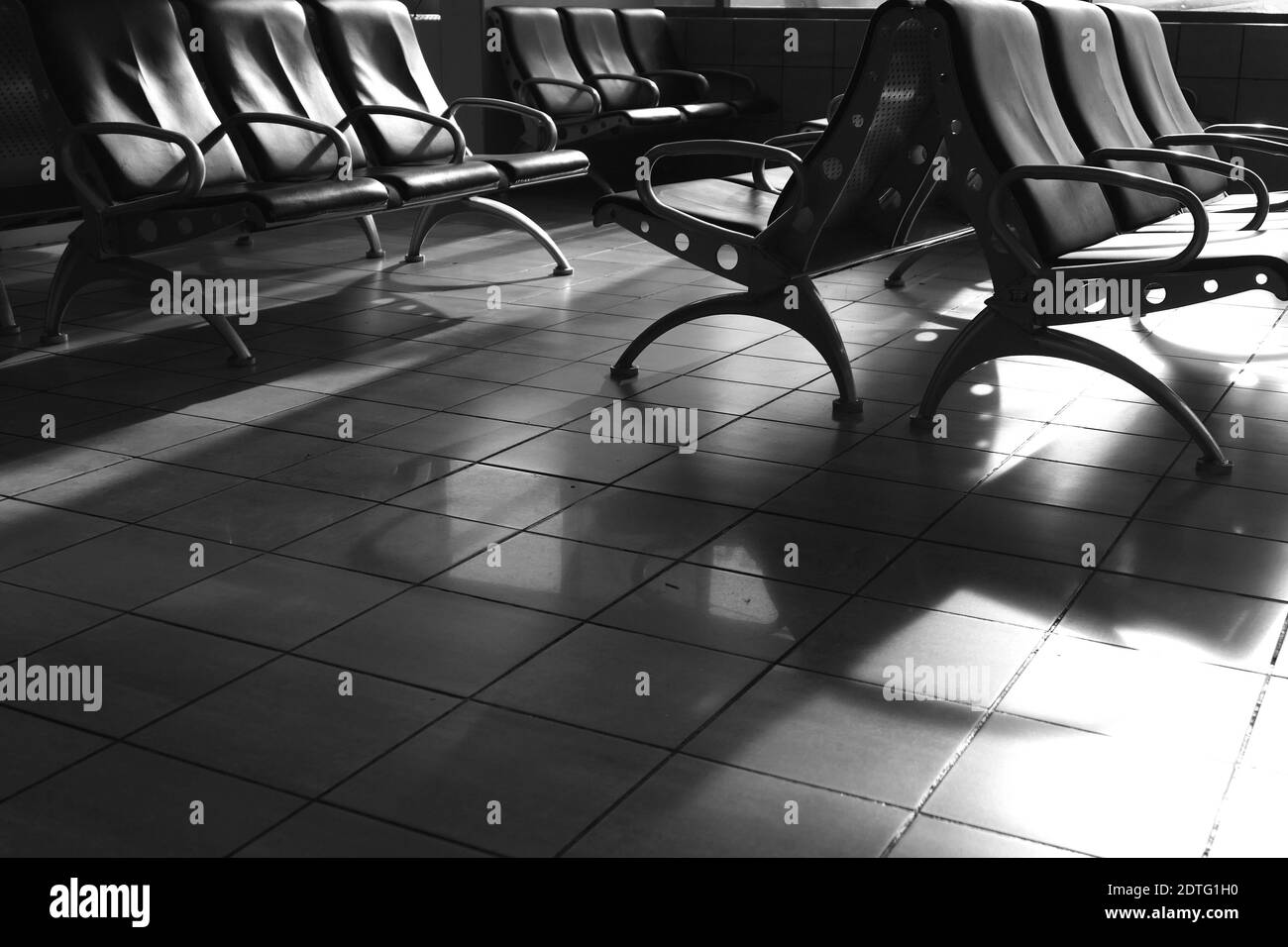 Airport waiting room seats Black and White Stock Photos & Images - Alamy
