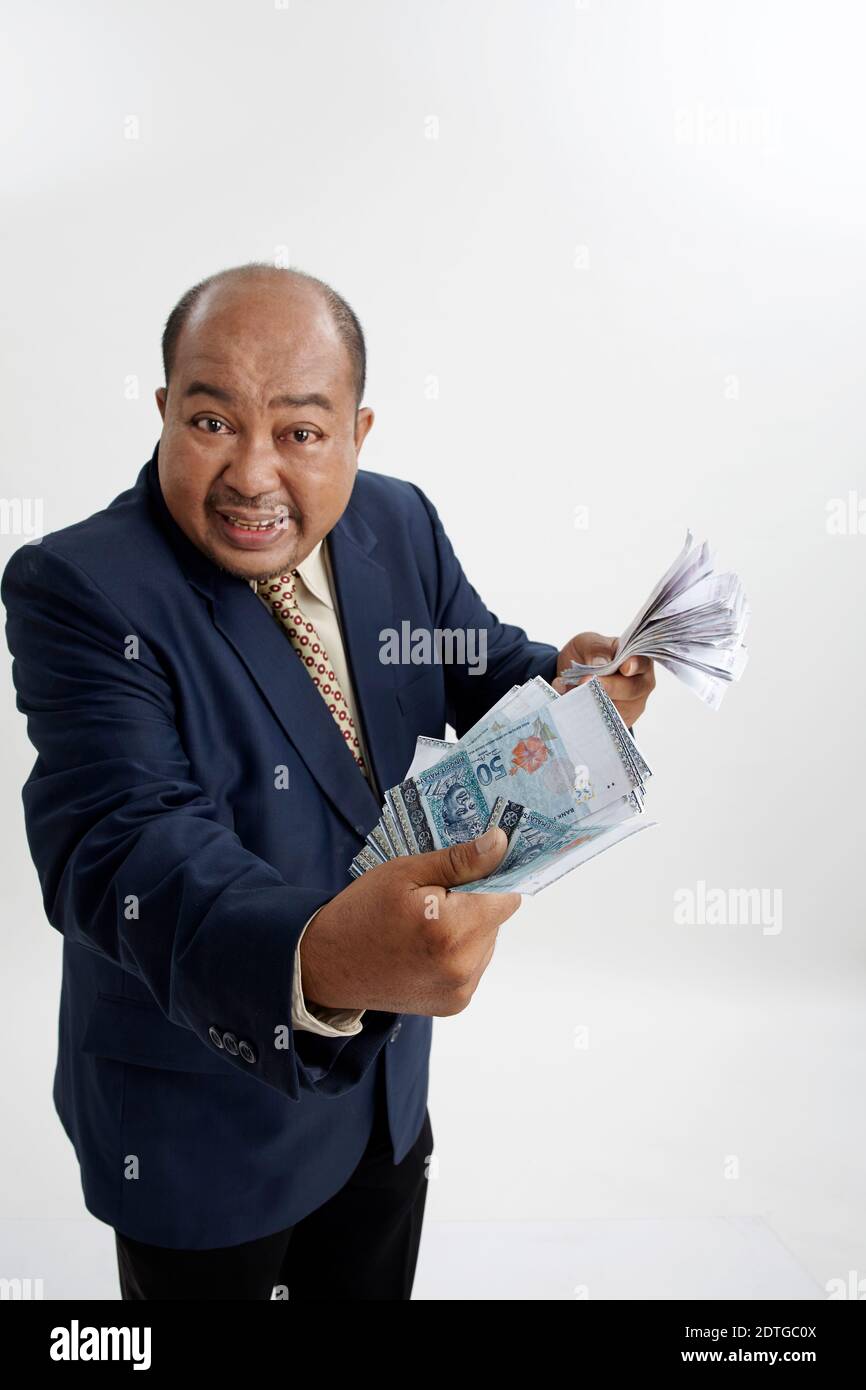 Malay Businessman Holding Lot Of Money Stock Photo Alamy