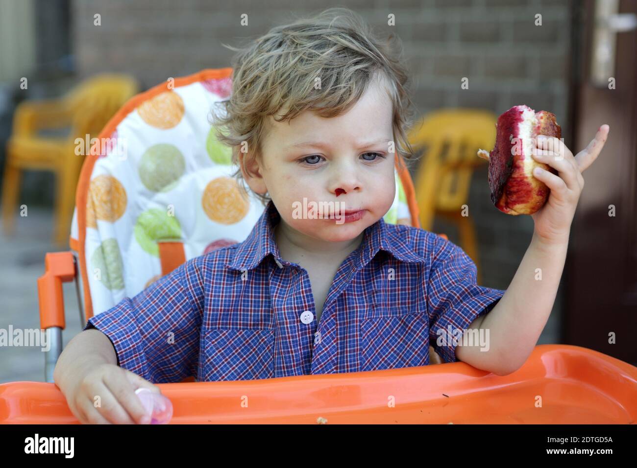 Portrait boy eating sweet bun hi-res stock photography and images - Alamy