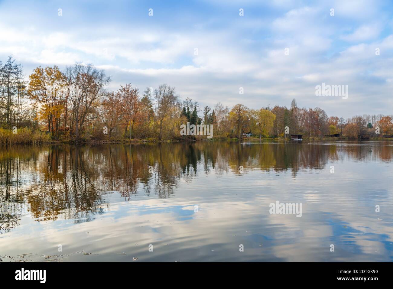 Panorama with reflections in the water at the Grube Fernie in Grossen-Linden close to Giessen, Germany Stock Photo