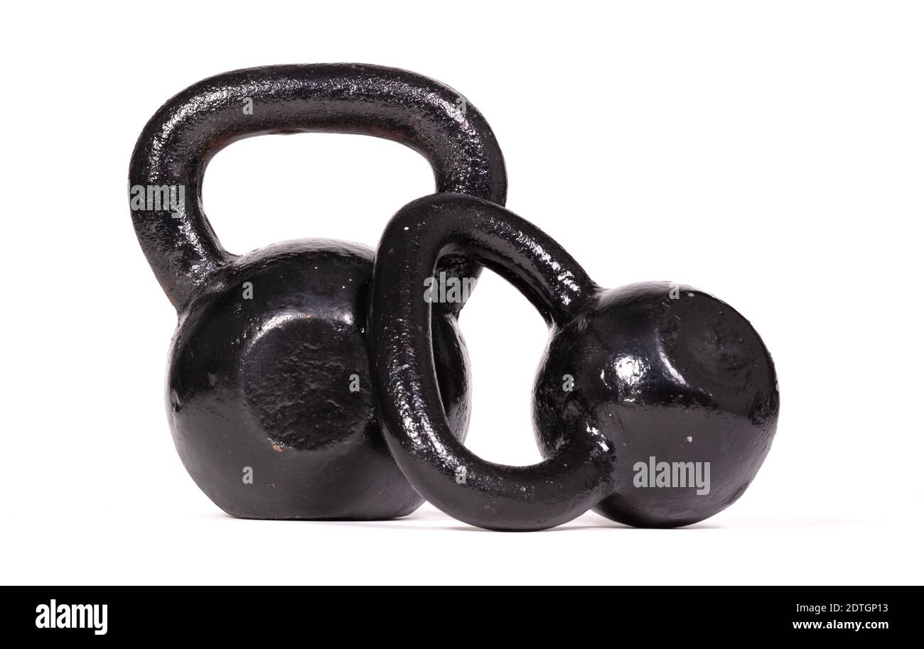 Black kettlebells isolated on a white background Stock Photo - Alamy