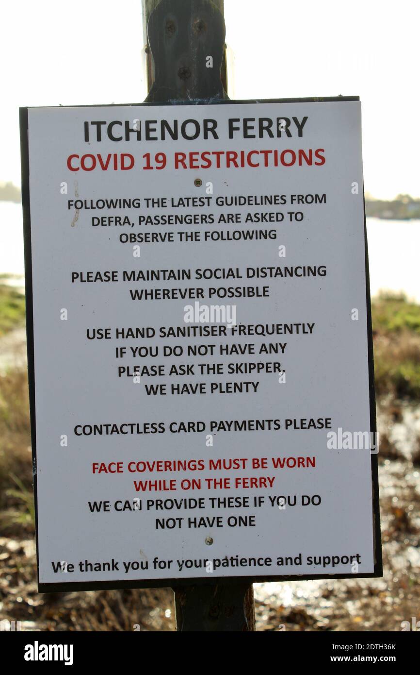 Itchenor Ferry - Covid 19 Restrictions - Information board giving guidelines for those wishing to use the Bosham Itchenor ferry. Stock Photo