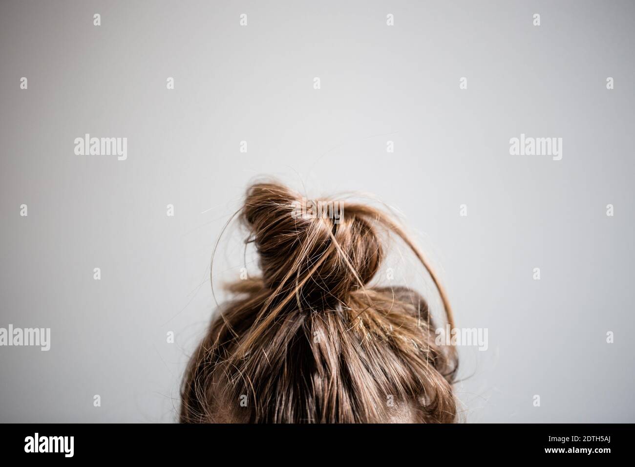 hair in messy bun Stock Photo