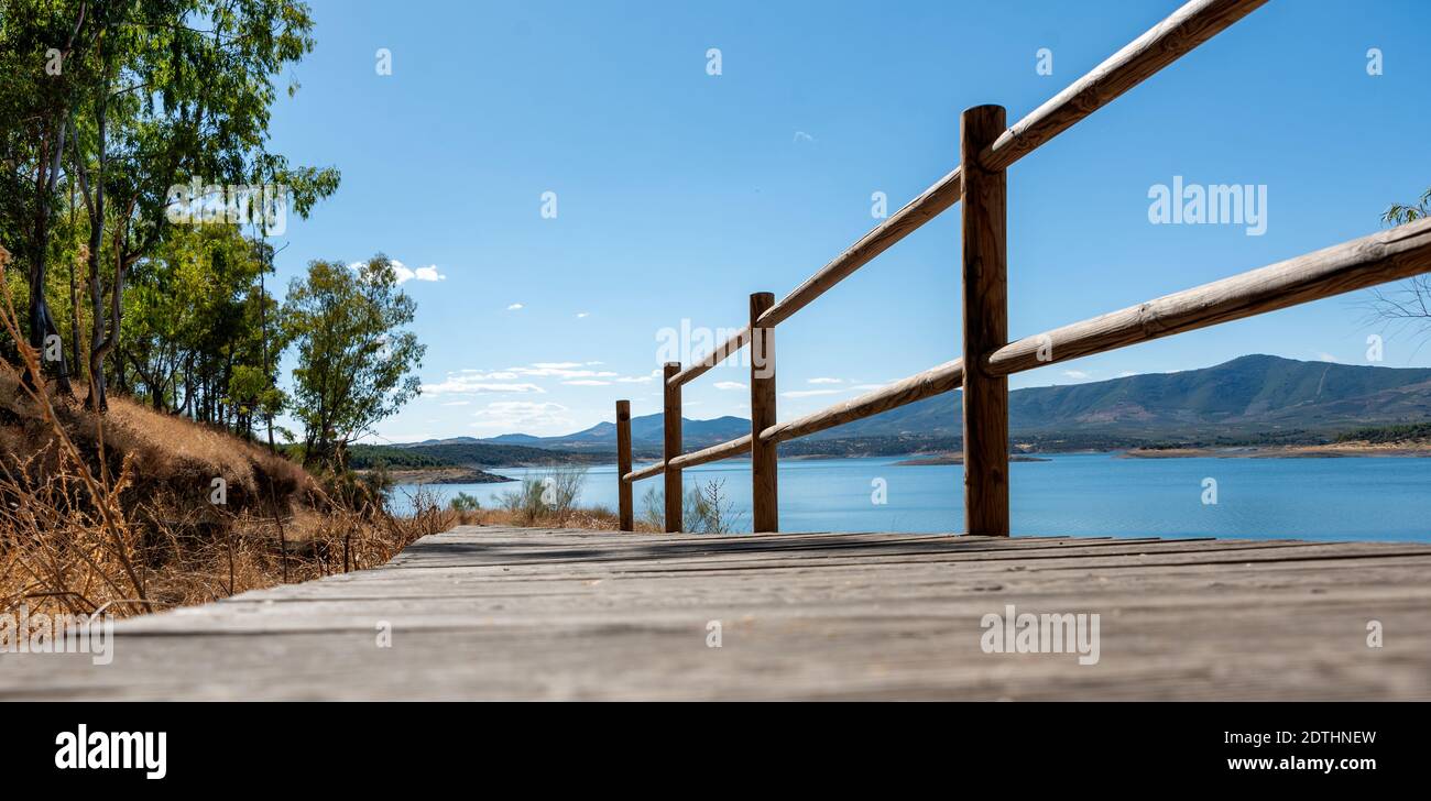 Landscape of natural environment with footbridge with railing towards ...