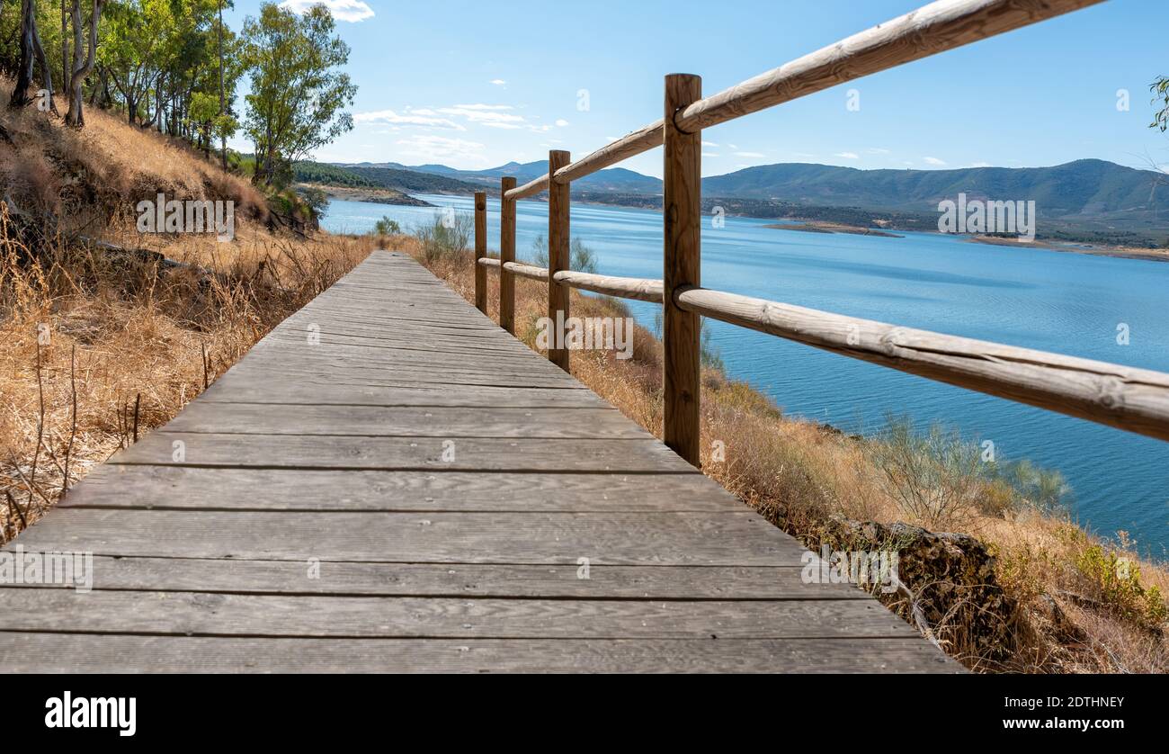 Landscape of natural environment with footbridge with railing towards ...